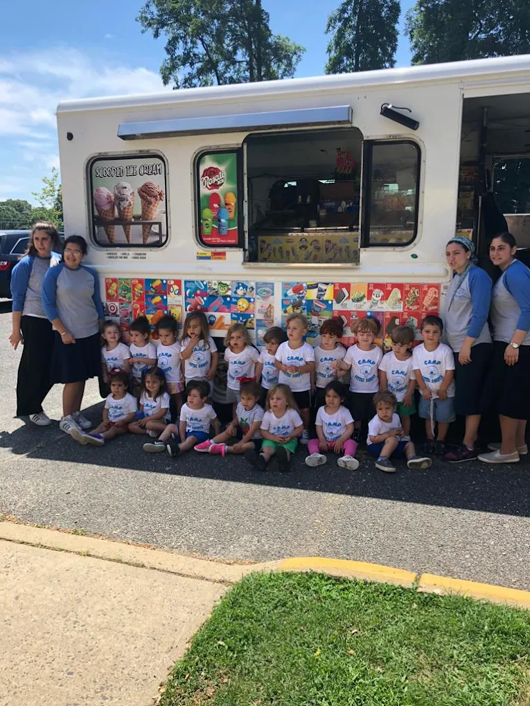 Camp group posing with the Twins Ice Cream truck